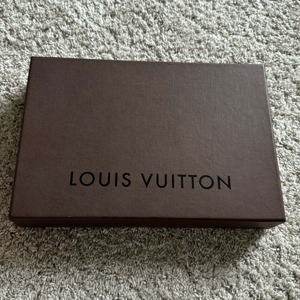Vintage Louis Vuitton box with dust bag.